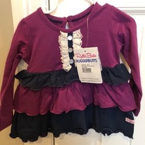 Purple peplum style top. Rufflebutts